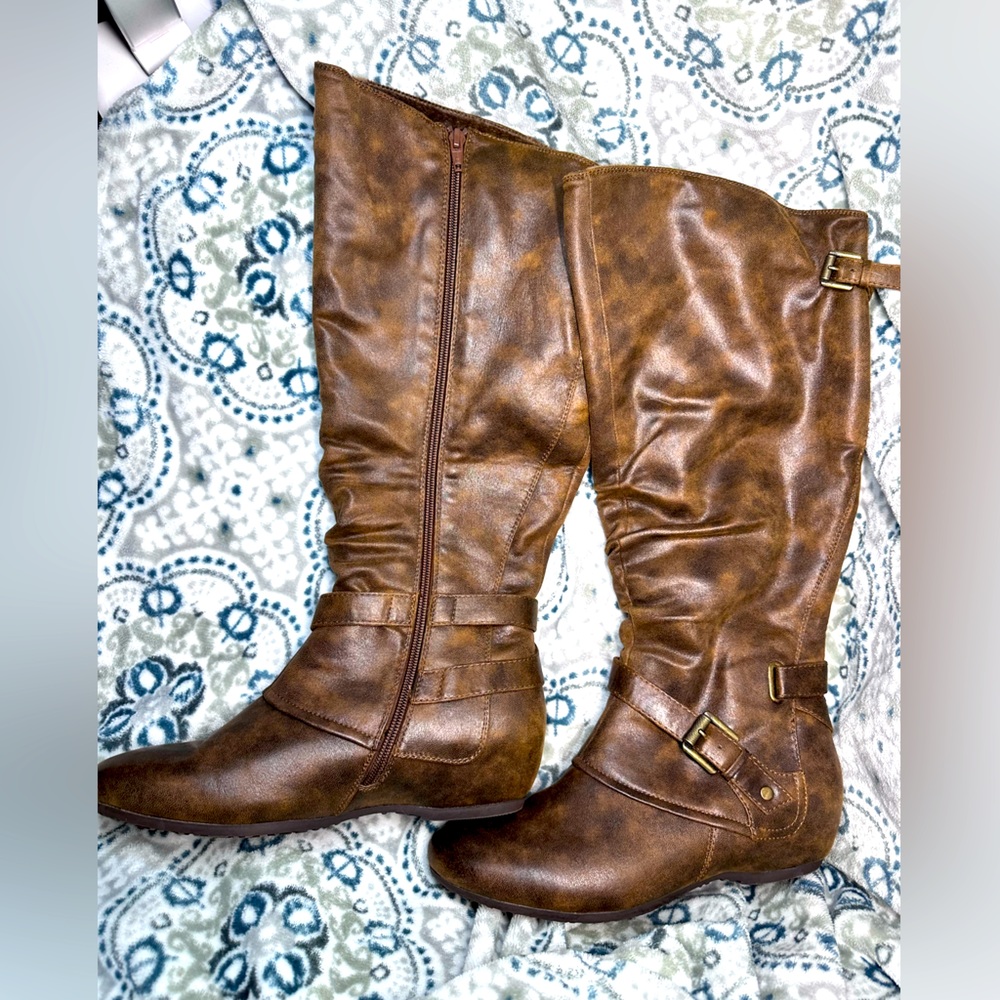 Woman’s size 9 brown wedge boots with Rebound soles.